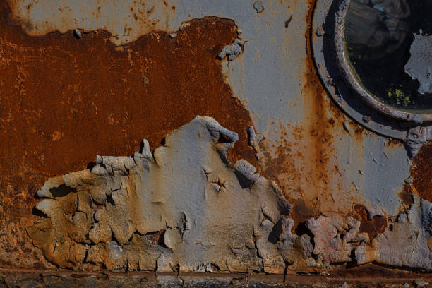 istock This is an old iron wall with a porthole covered with corrosion 1181900288