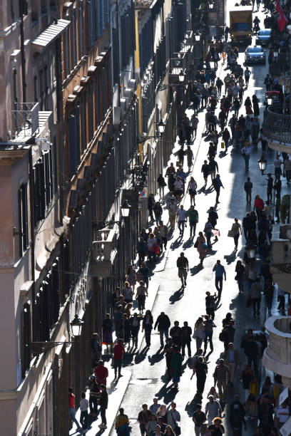istock Crowd of people walking on street 1181900450