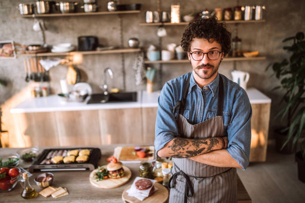 istock Portrait of tattooed chef in the kitchen 1181901712