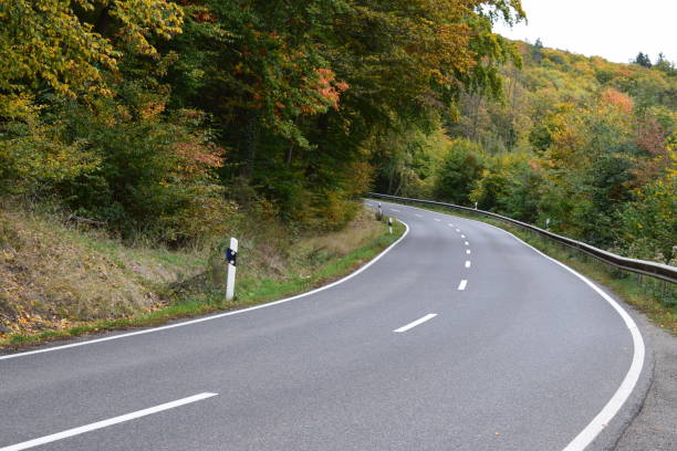 istock autumn road curve 1181902550