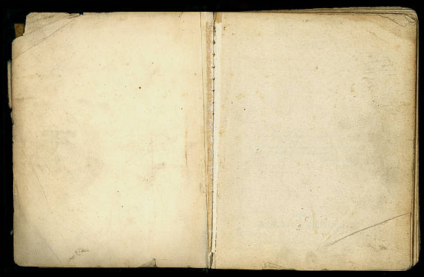istock Old book opened with aged and dog eared pages 118190397