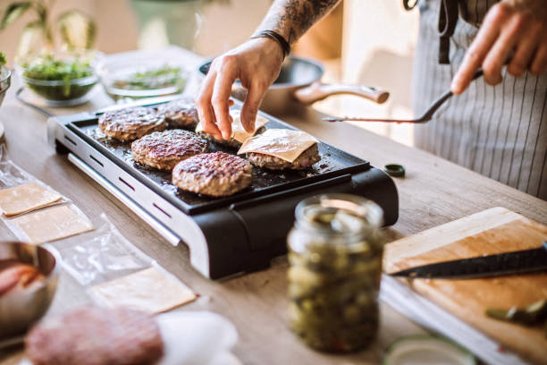 istock Homemade cheeseburgers are his specialty 1181904328