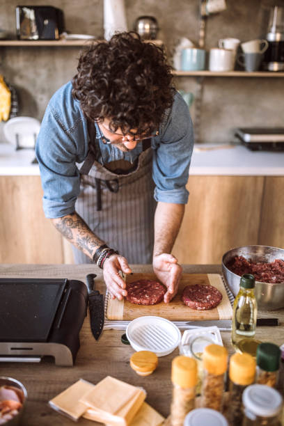 istock He preparing something special whenever he's in the kitchen 1181904594