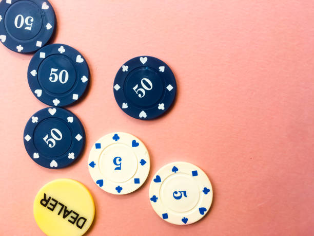 istock Poker chips on a pink background. Place for text. 1181905558