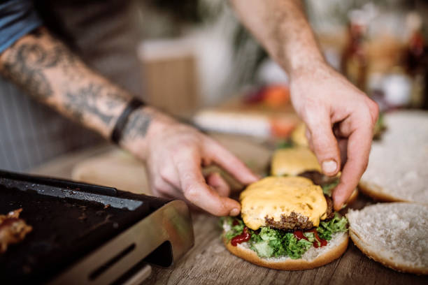 istock Adding some cheese on homemade burgers 1181905706