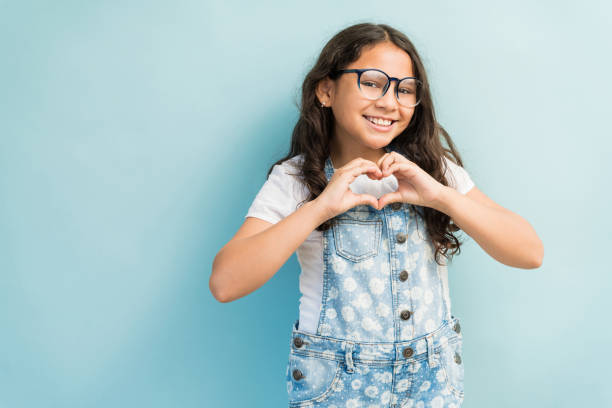 istock Latin Female Child Gesturing In Studio 1181905726