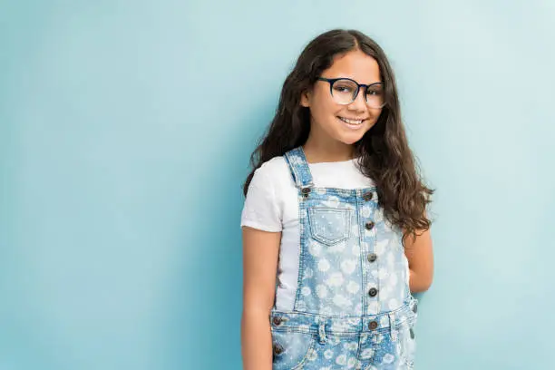 Photo of Adorable Female Child Wearing Eyeglasses