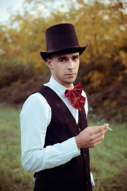 istock Young man smoking cigarette outdoors 1181905960