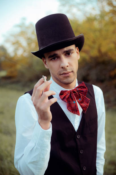 istock Young man smoking cigarette outdoors 1181906142