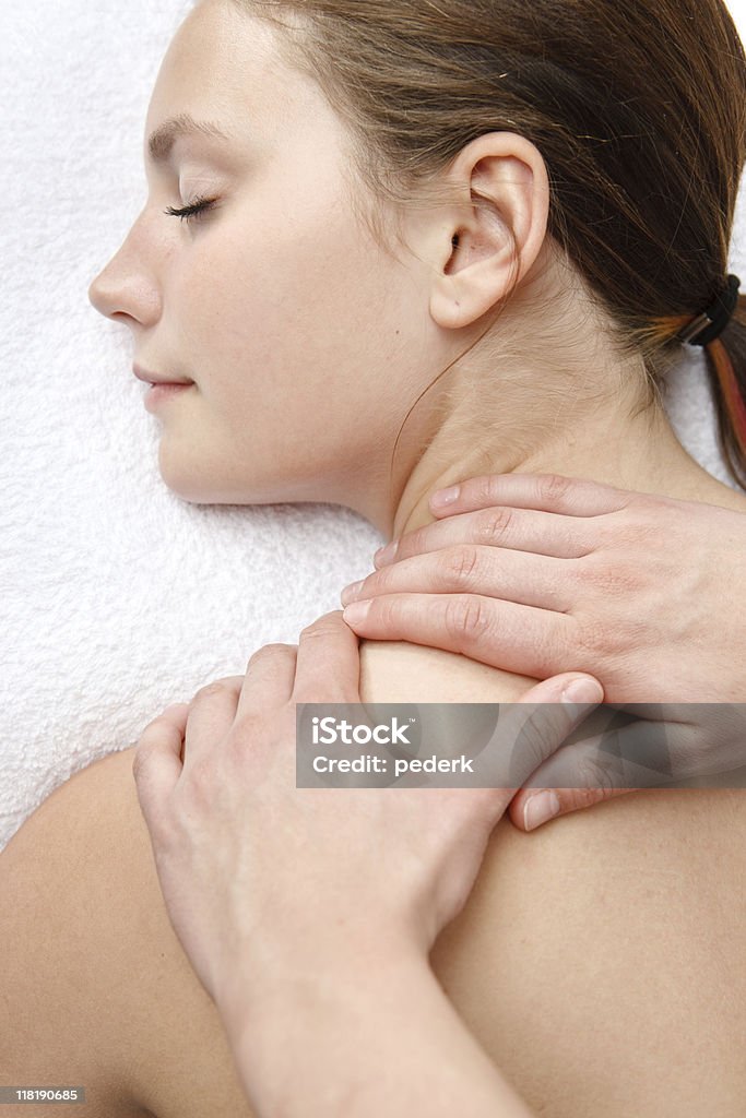 Orthopedic massage Young woman getting massage at spa treatment Adult Stock Photo