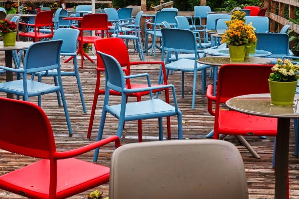 istock Red and blue chairs, round tables 1181907009