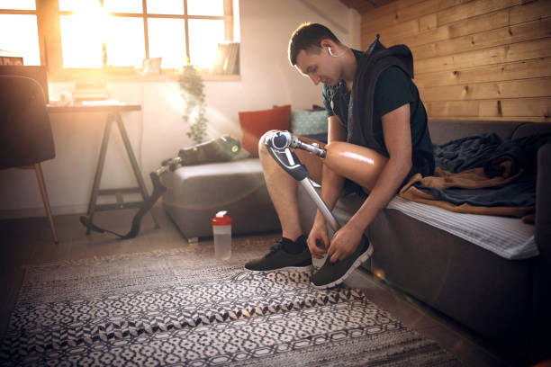 istock Man with amputee leg listening music and getting ready for training 1181907303