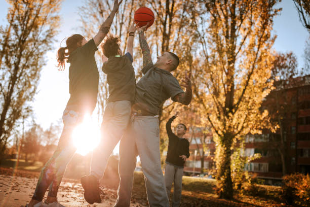 there's nothing more fun than playing basketball together - women jumping bouncing spring imagens e fotografias de stock