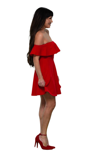 full length / side view / profile view / one person of 20-29 years old adult beautiful black hair / long hair latin american and hispanic ethnicity female / young women standing wearing dress and high heels / cool attitude with hand by side - 20 25 years profile female young adult imagens e fotografias de stock