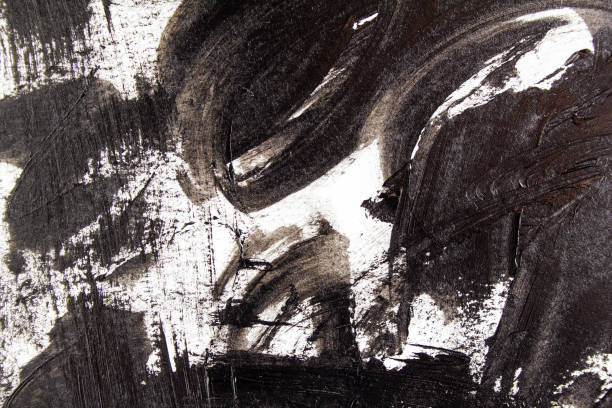 istock Closeup black acrylic brush strokes and scribble on white canvas. Abstract grunge handmade drawing. 1181911749