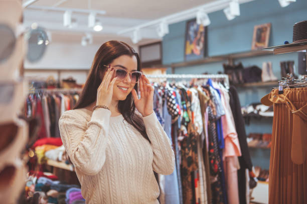 istock Charming woman shopping for new clothes 1181912112