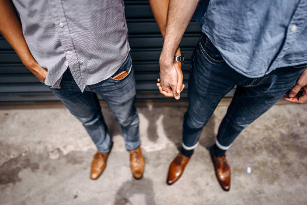 istock Homosexual couple holding hands 1181912171