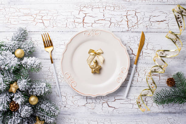 istock Christmas table setting and golden decor 1181913365