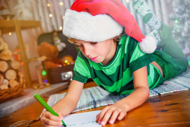istock Little Boy Writing a Letter to Santa 1181914240