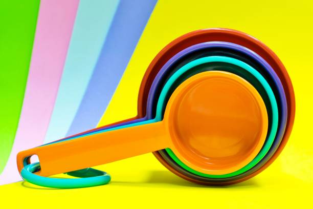 Colorful Plastic Measuring Cups On A Rainbow Background Stock Photo -  Download Image Now - iStock