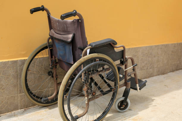 istock Empty wheelchair parked outside 1181919240