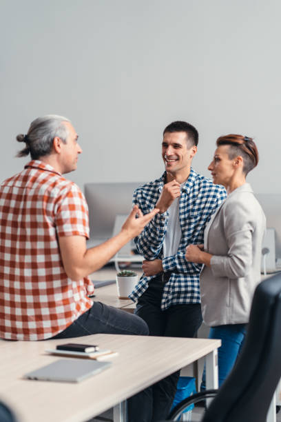 istock Business people having funny conversation at the office 1181919706