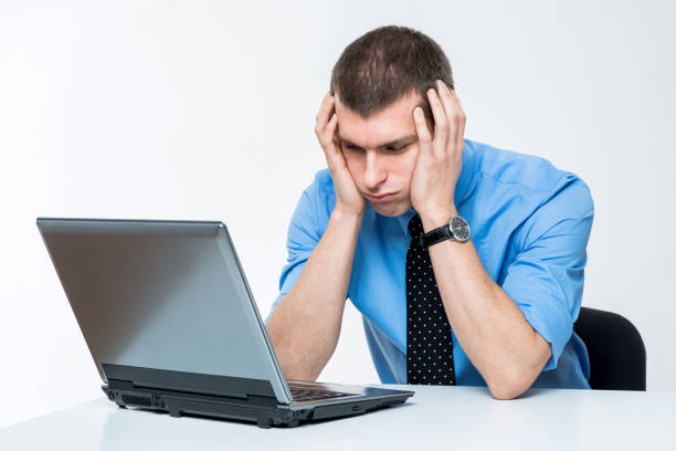 istock Frustrated young businessman at work 1181921146