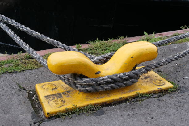 istock Yellow bollards on the harbor wall for attachment to the ship 1181921915