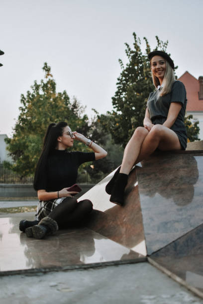 istock Happy female friends reading 1181924005