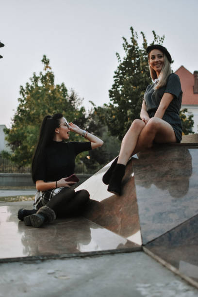istock Happy female friends reading 1181924027