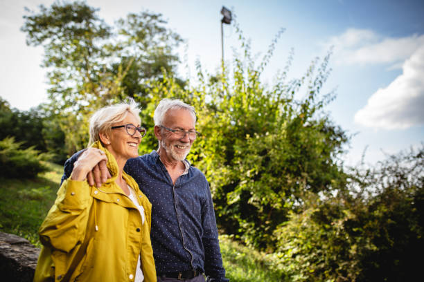 istock Senior couple enjoying in park 1181927067