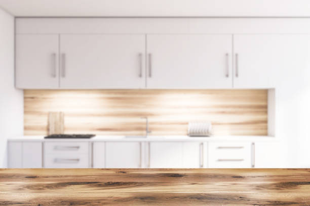 istock Blur white and wooden kitchen, white countertops 1181927192
