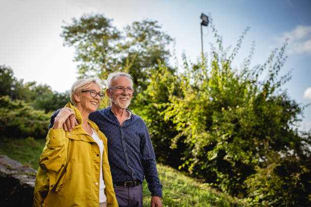 istock Senior couple enjoying in park 1181927808