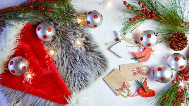 istock Christmas holiday concept with baubles and decorations scattered on table. 1181928288