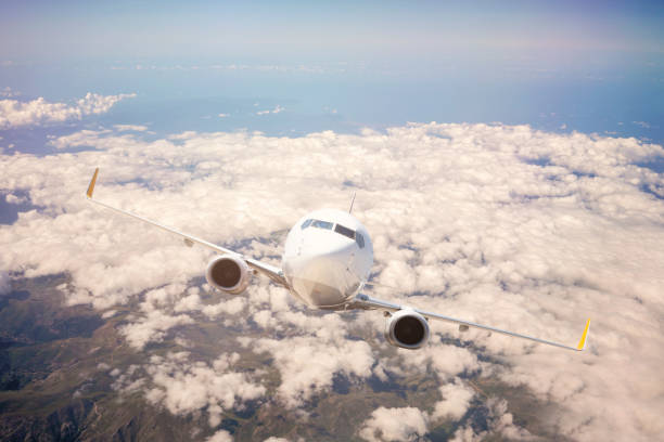 istock Passenger jet airplane flying above clouds stock 1181929166