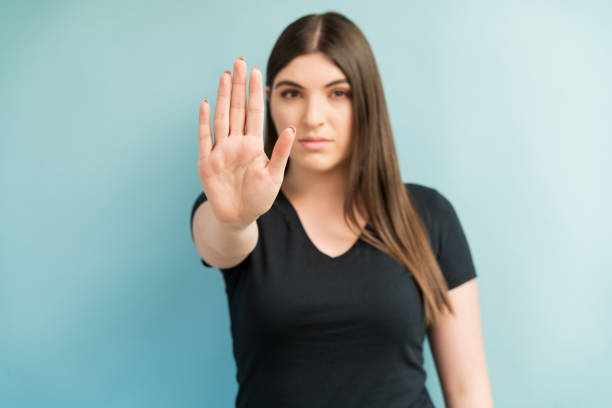 istock Attractive Female Is Showing Her Palm 1181930393