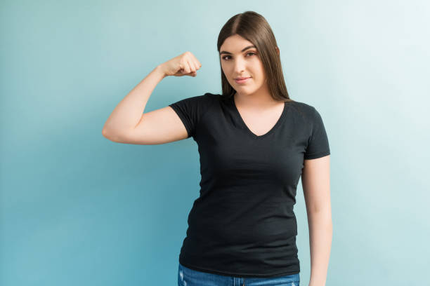 istock Pretty Female Showing Her Biceps 1181930458
