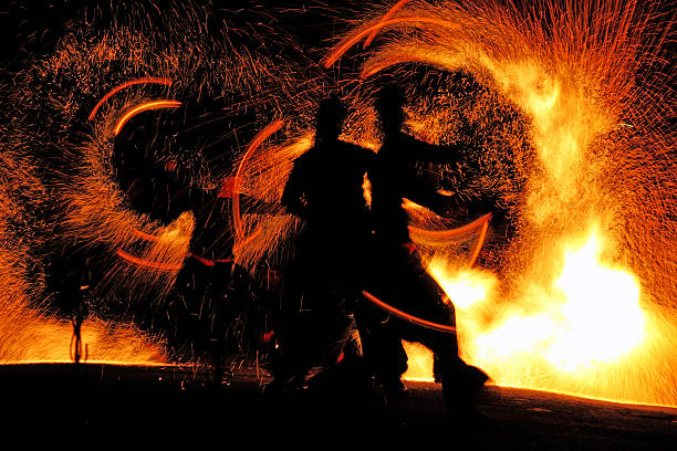 istock A fire show at night with flames flying 118193134