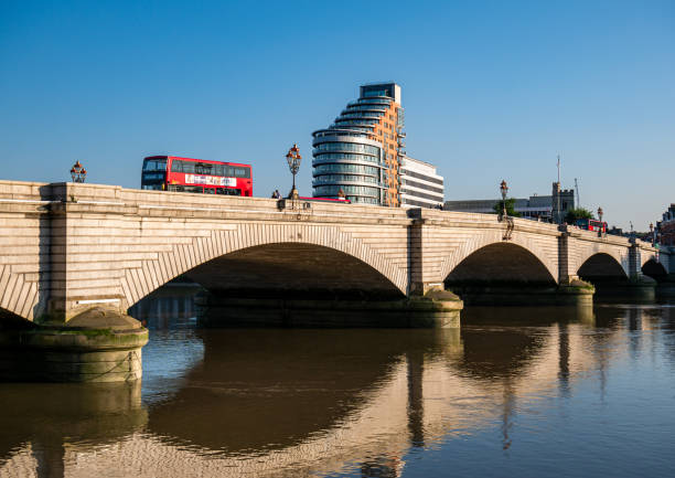 Putney bridge reflected in Thames river London, England, United Kingdom - August 25, 2019: Putney bridge reflected in Thames river water in a sunny day putney photos stock pictures, royalty-free photos & images