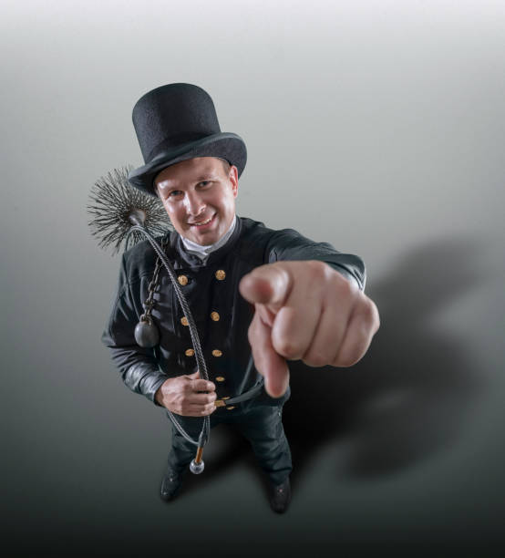 istock Chimney sweeper pointing with finger at you 1181943175