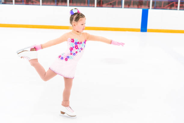 istock Little girl practicing figure skating moves 1181944600