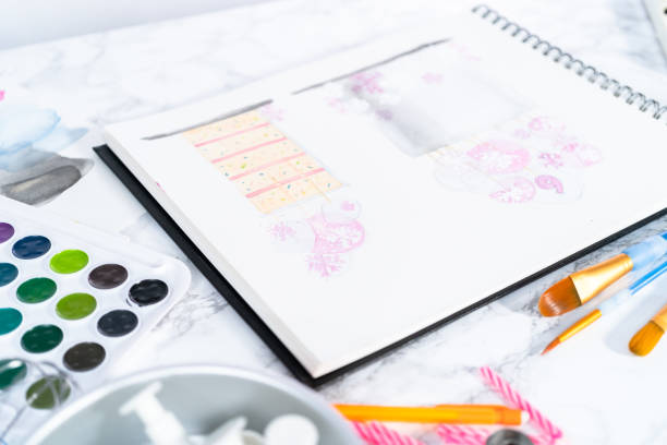 istock Baker is designing a birthday cake for 1181944623