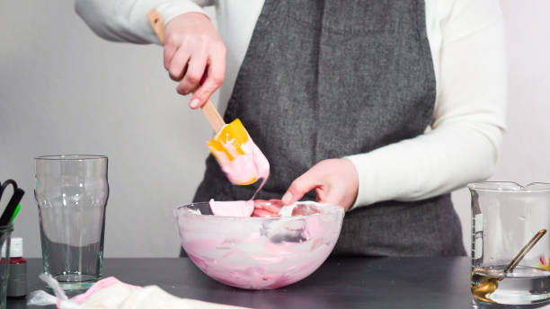 istock Mixing in food coloring into the royal icing 1181945942