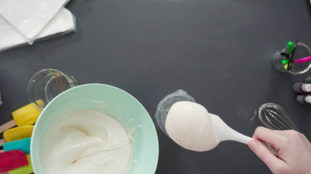 istock Pouring royal icing into the piping bag 1181945949
