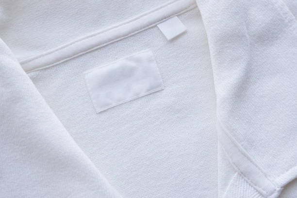 istock Blank white clothes label on new shirt background 1181946286