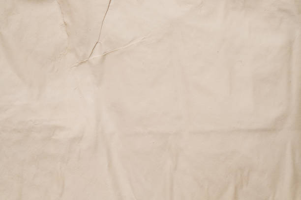 istock beige wet paper creased moist surface background 1181946379