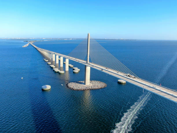 Aerial view of Sunshine Skyway, Tampa Bay Florida Aerial view of Sunshine Skyway, Tampa Bay Florida, USA. Big steel cable suspension bridge. elevated walkway stock pictures, royalty-free photos & images