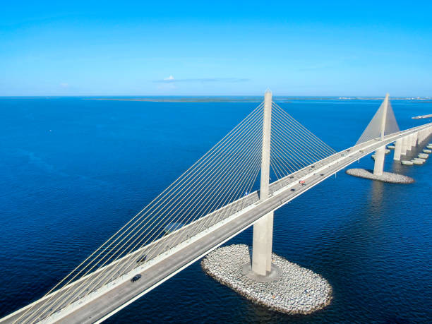 Aerial view of Sunshine Skyway, Tampa Bay Florida Aerial view of Sunshine Skyway, Tampa Bay Florida, USA. Big steel cable suspension bridge. elevated walkway stock pictures, royalty-free photos & images