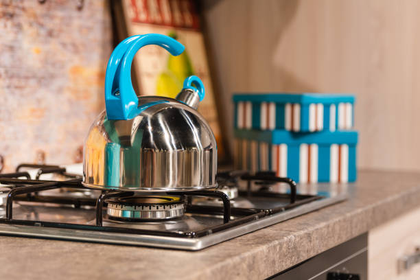 istock teapot on the stove 1181953834