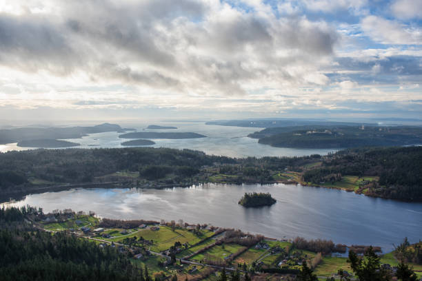Dynamic Morning Sky Over Lake Campbell and the Hope Island State Park View from top of Mt Erie, Fidalgo Island, Washington puget sound stock pictures, royalty-free photos & images